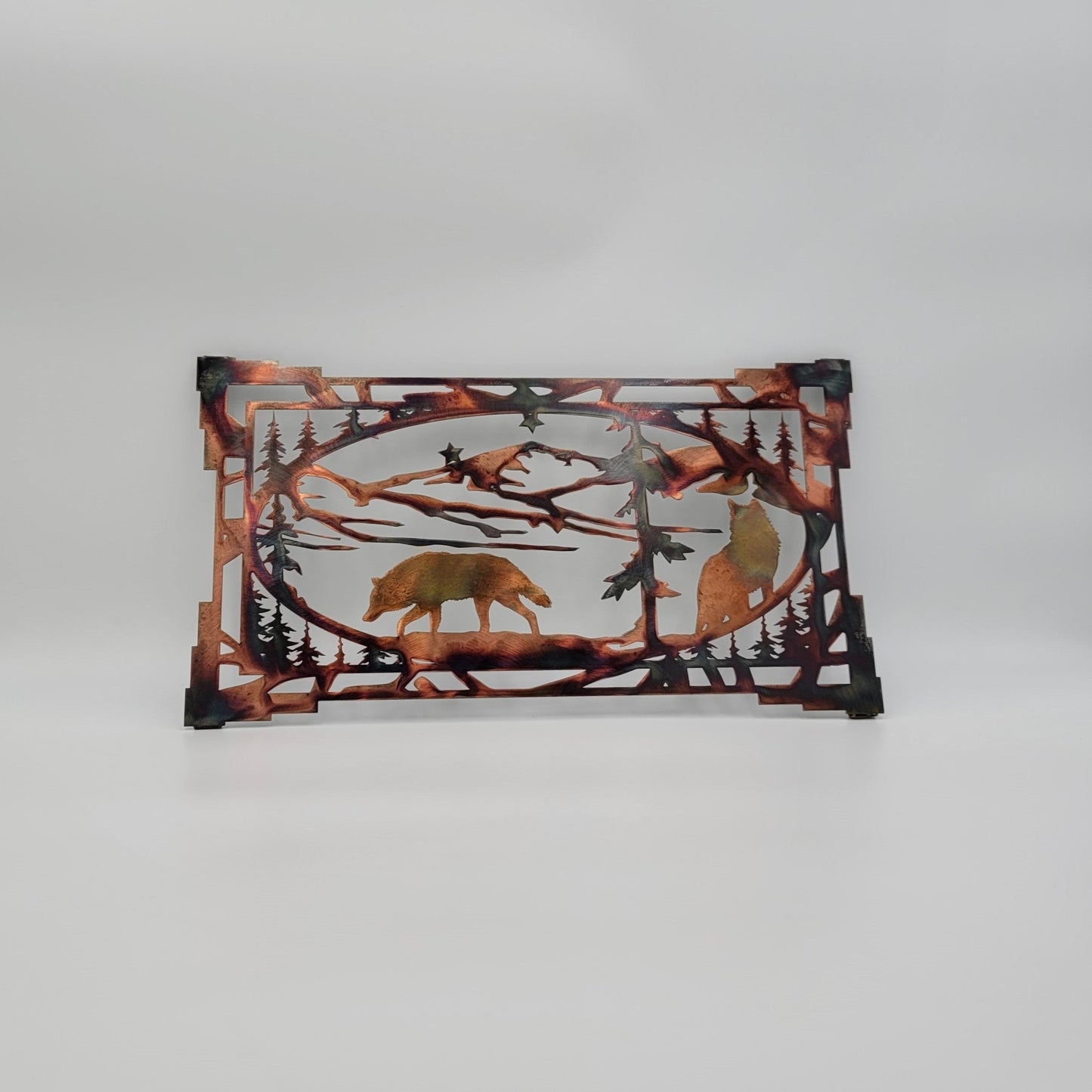 Southwest Wolf Wall Hanging. Available in two sizes, Large measures 16 Inches High x 30 Inches Wide x 18 gauge. Medium measures 11 Inches High x 20 Inches Wide x 18 gauge. Tabs on back for easy hanging. Hangs via two nails, not included. Sprayed with several layers of Varathane.