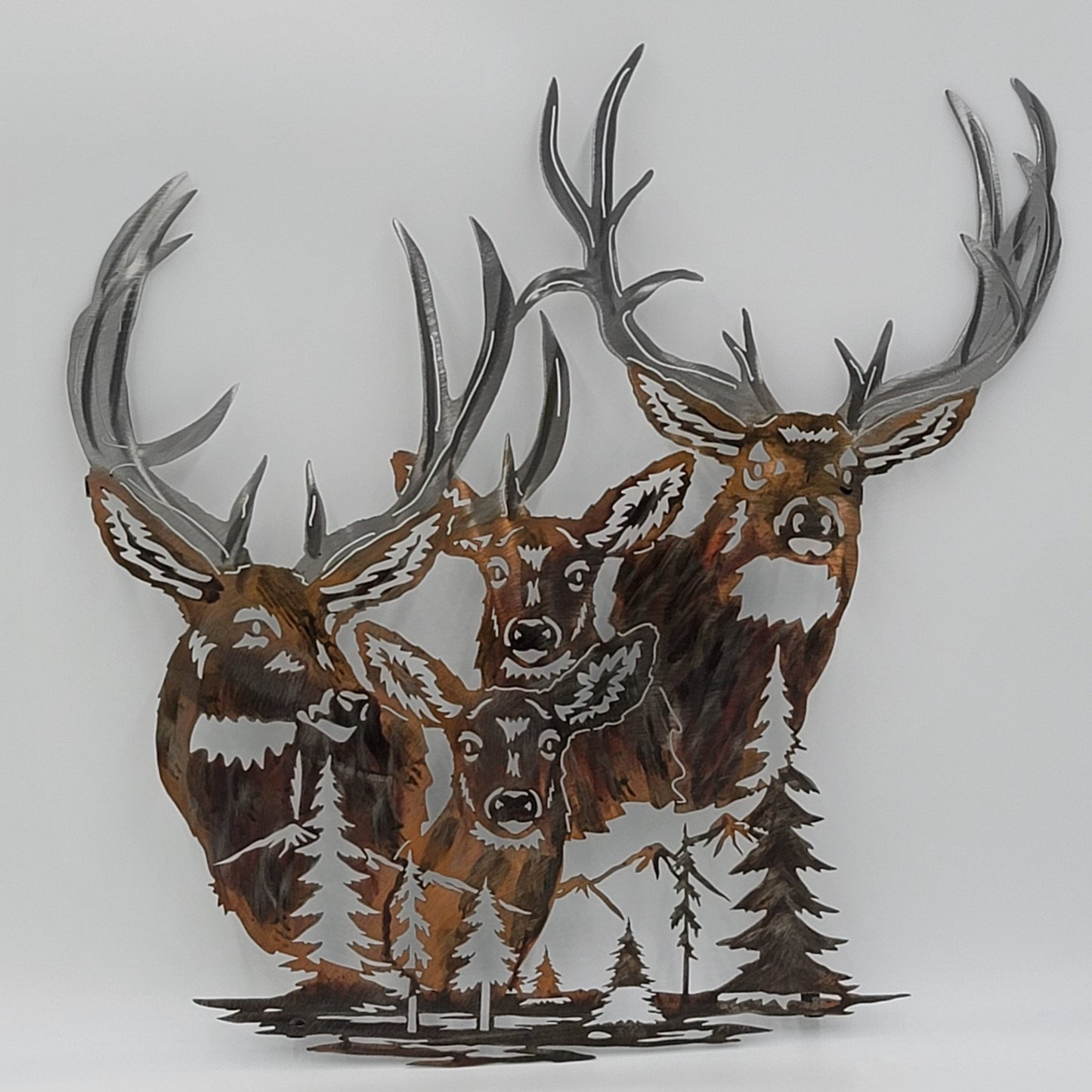 Deer Head Wall Hanging. Measures 21.5" High x 20.5 " Wide. Available in four colors, Colored-Rustic, Black, Hammer Tone, Bare Metal. This is the colored-rustic version. Tabs on back for hanging. Hangs via two nails not included. Sprayed with a thick layer of Varathane.