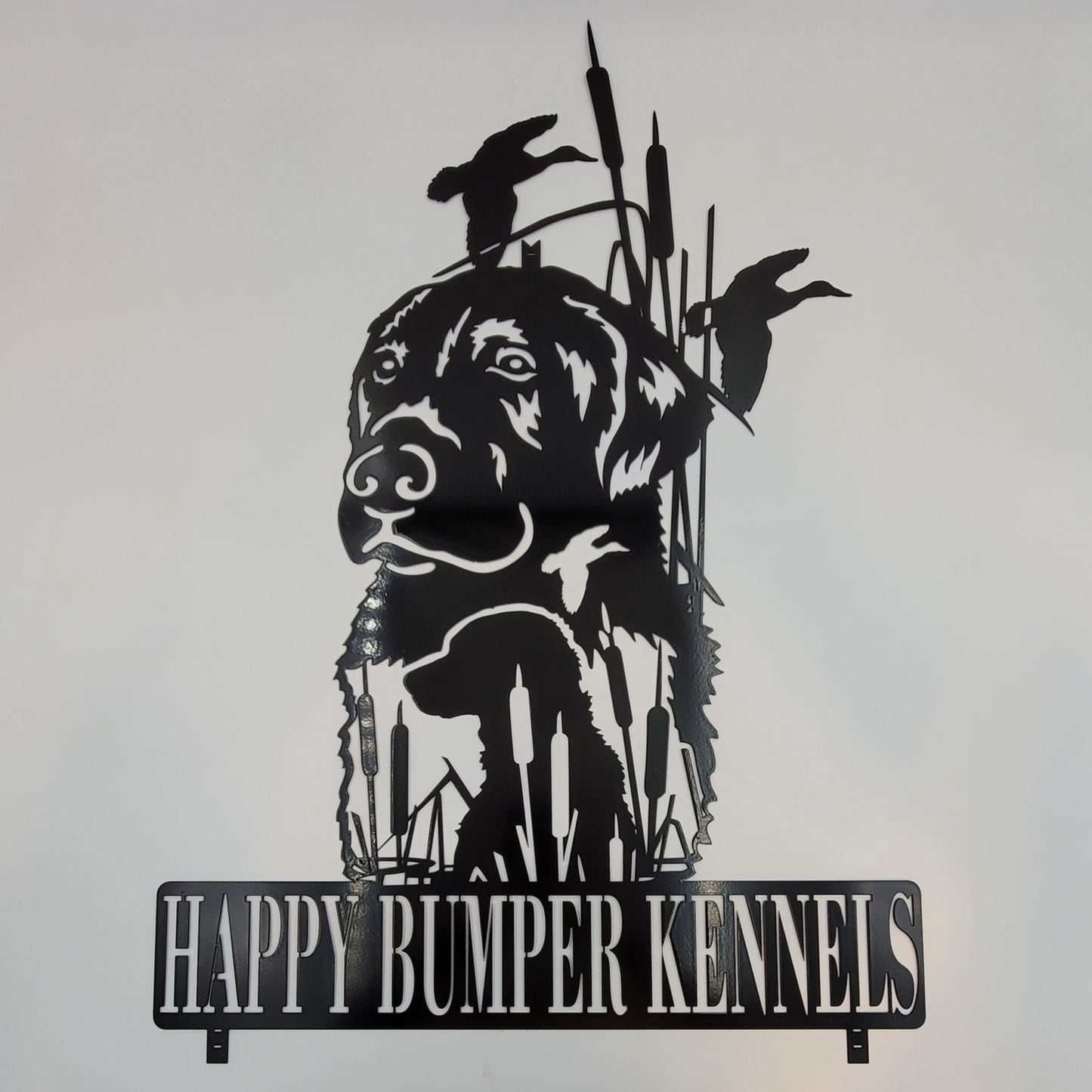 Black Lab with Cattails, ducks, baby black lab. This was a custom order we did. If you order it won't have the name on the bottom unless you choose to have it personalized. Comes in four colors, Black, Colored, Hammer Tone, Bare Metal. Measures 25"H x 14" W x 18 gauge Thick. Gift wrapping available at checkout.