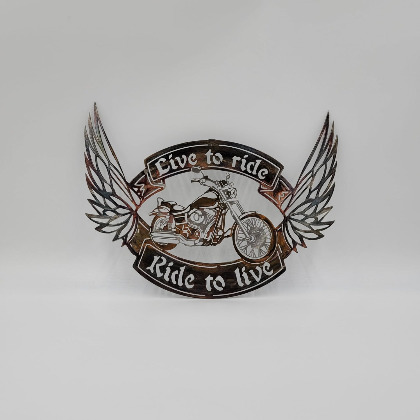Live To Ride, Ride To Live Motorcycle Wall Hanging. Made from 18-Gauge Sheet Metal. Measures 11 1/2" High x 15 1/2" W x 18 gauge Thick. Four color options available; Colored-Rustic, Black, Hammer Tone, Bare Metal. Sprayed with a thick layer of Varathane.
