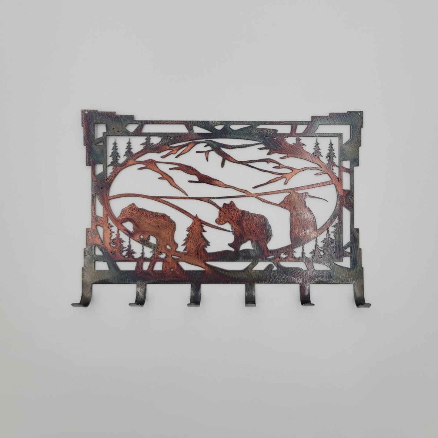 Southwest Bear Cubs Rectangular Metal Wall Mounted Key Rack with 6 hooks. Measures 8 Inches Wide by 5.25 Inches High. Offered in four colors, Colored=Rustic, Black, Hammer Tone, Bare Metal. Holes in top corners for hanging.