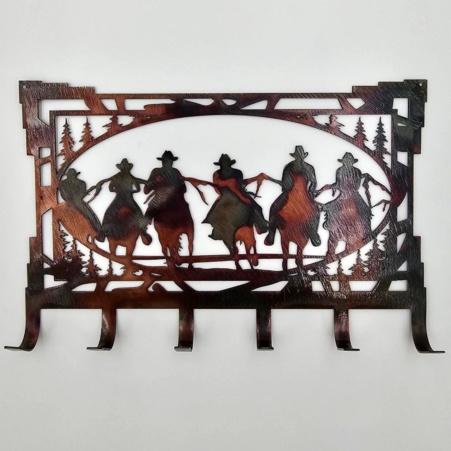 Rustic Cowboy Metal Key Hanger Measures 8 Inches Wide x 5.25 Inches High. 6 Hooks. Available in four colors Colored-Rustic, Black, Hammer Tone, Bare Metal.