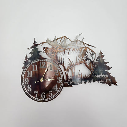 Rustic Metal Elk Wall Clock featuring a bugling elk, pine trees, and mountain scene