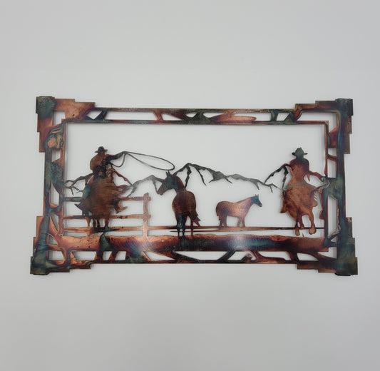 Two Roping Cowboys roping some horses in a mountain scene. Very colorful with copper, gold, green, blues, browns. Aztex border. Brackets on back for easy hanging. Available in Large and Medium. Comes ready to hang.