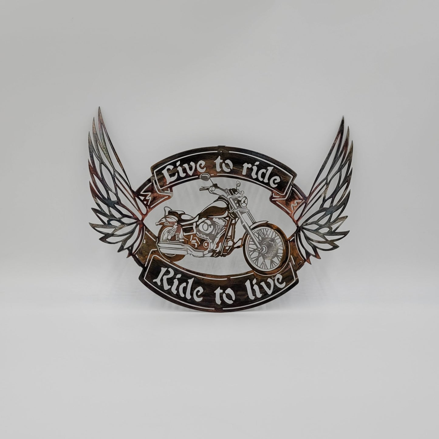 Live To Ride, Ride To Live Motorcycle Wall Hanging. Made from 18-Gauge Sheet Metal. Measures 11 1/2" High x 15 1/2" W x 18 gauge Thick. Four color options available; Colored-Rustic, Black, Hammer Tone, Bare Metal. Sprayed with a thick layer of Varathane. 